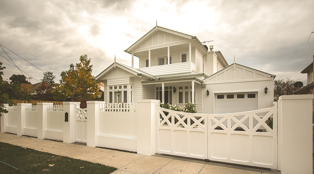 Picket fence with wooden gates